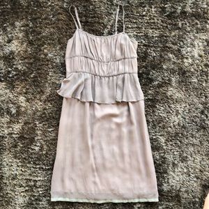 Taupe dress with mint green ribbon across bottom.